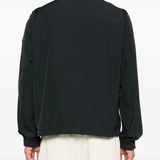 Black jacket worn by a person, showing the jacket fit