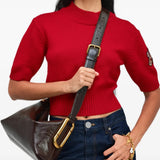 Brown bag worn by a person, showing the bag fit