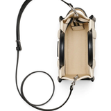 Close up of tan bags, showing texture of the cow leather fabric