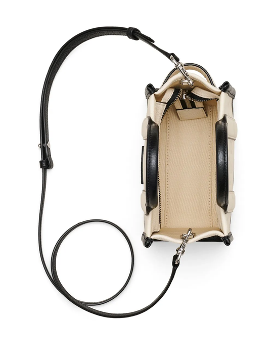 Close up of tan bags, showing texture of the cow leather fabric