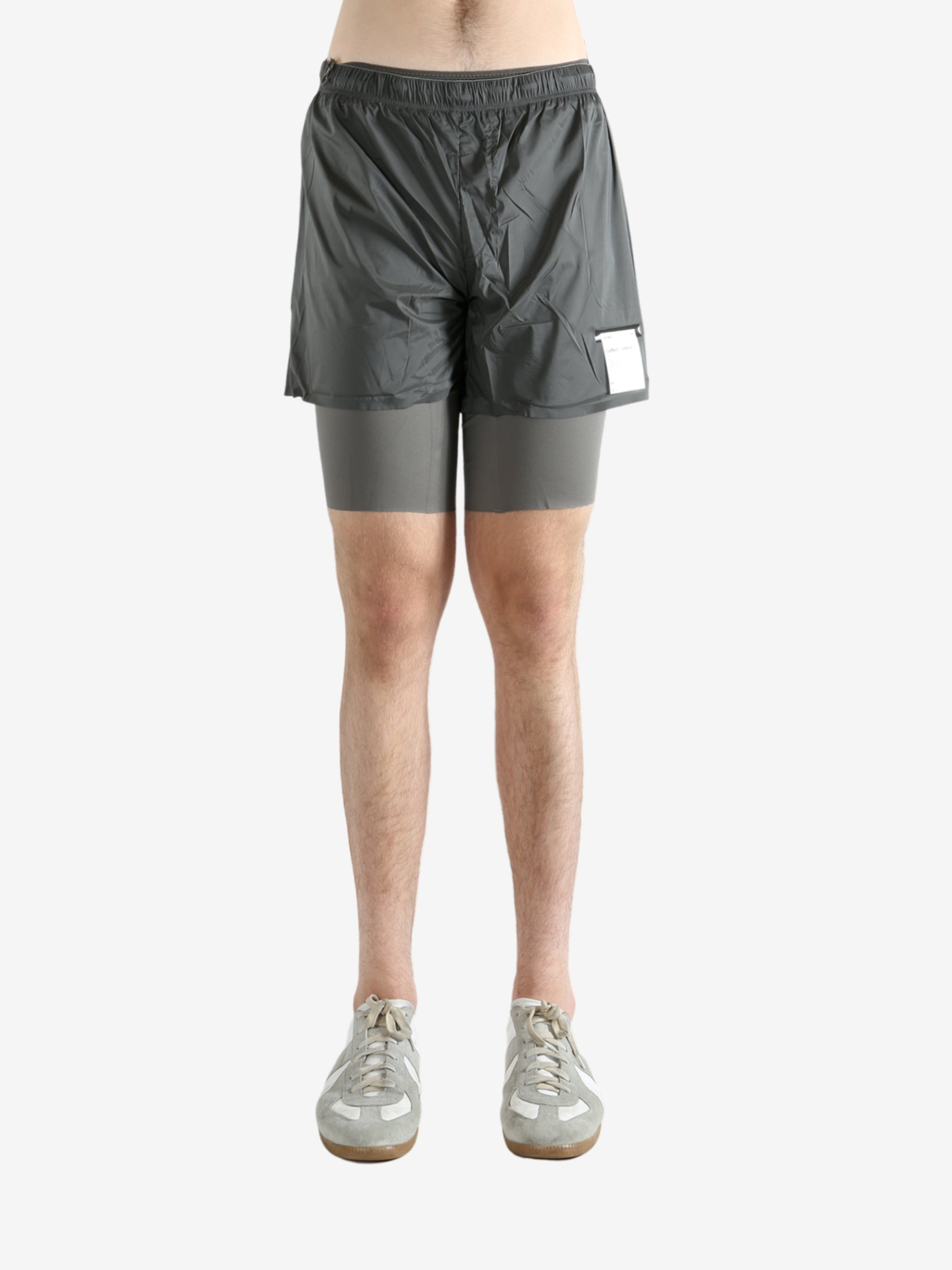 Grey shorts worn by a person, showing the shorts fit