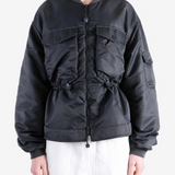 Black jacket worn by a person, showing the jacket fit