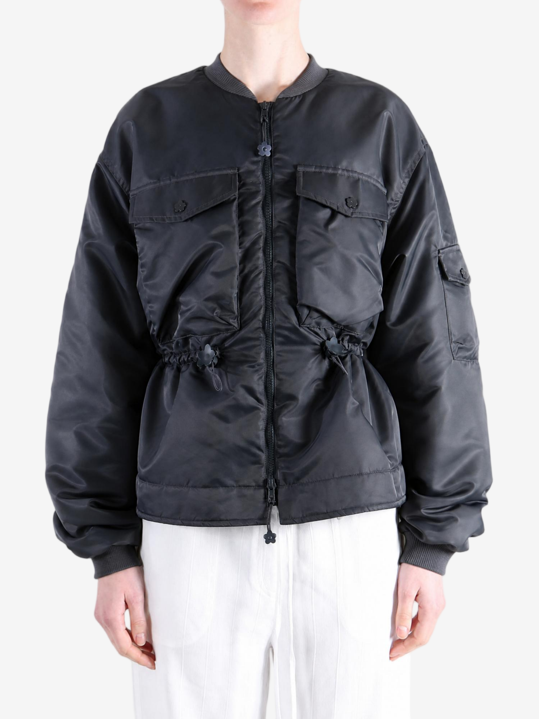 Black jacket worn by a person, showing the jacket fit
