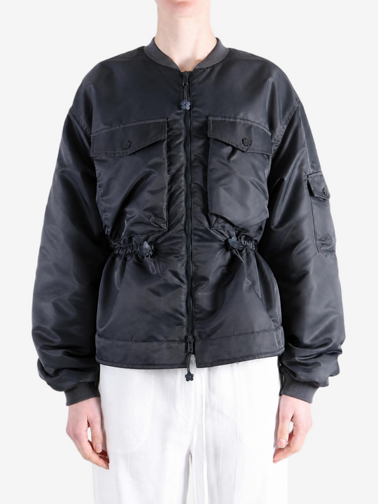 Black jacket worn by a person, showing the jacket fit