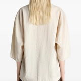 Close up of tan top, showing texture of the Silk and Polyamide fabric