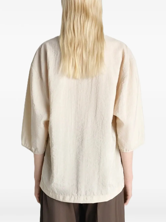 Close up of tan top, showing texture of the Silk and Polyamide fabric