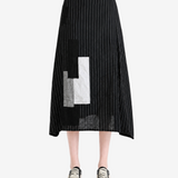 Black skirt worn by a person, showing the skirt fit