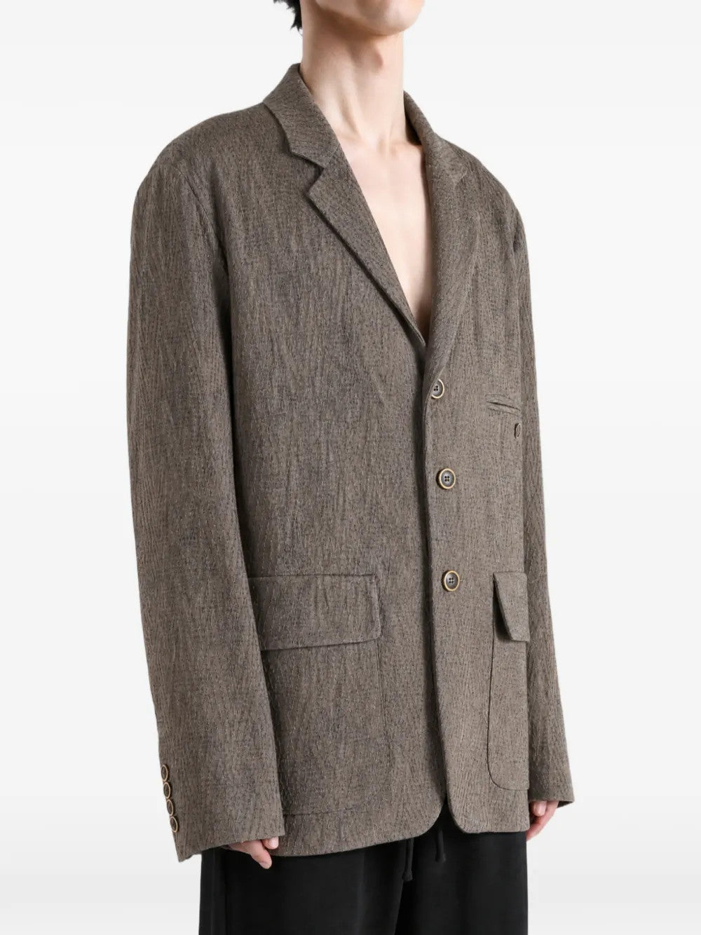 Grey jacket worn by a person, showing the jacket fit