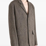 Grey jacket worn by a person, showing the jacket fit