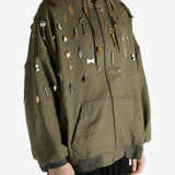 Green sweat worn by a person, showing the sweat fit