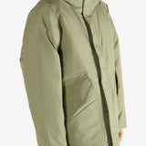 Green jacket worn by a person, showing the jacket's fit