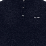 Close up of blue knitwear, showing texture of the Cashmere fabric