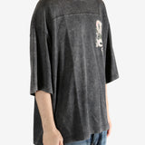 Black t-shirt worn by a person, showing the t-shirt's fit