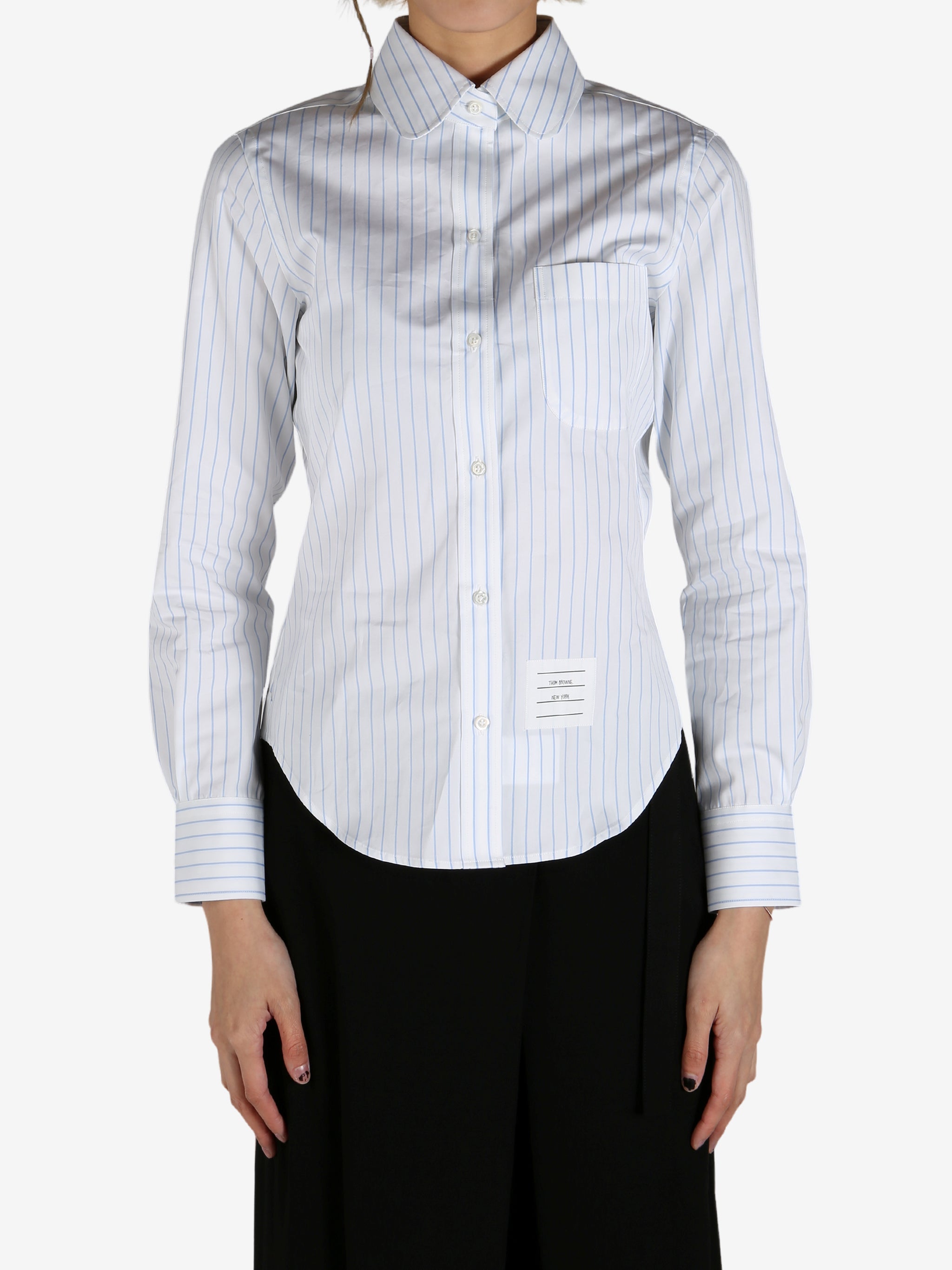 Blue shirt worn by a person, showing the shirt's fit