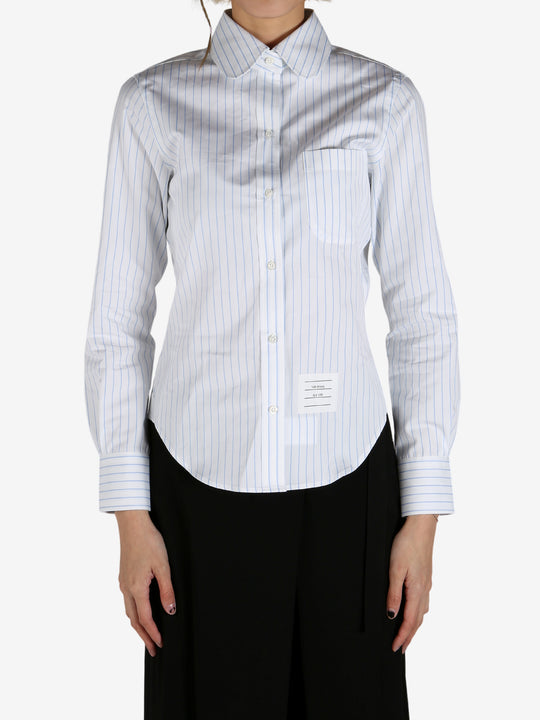 Blue shirt worn by a person, showing the shirt's fit