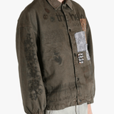 Green jacket worn by a person, showing the jacket's fit