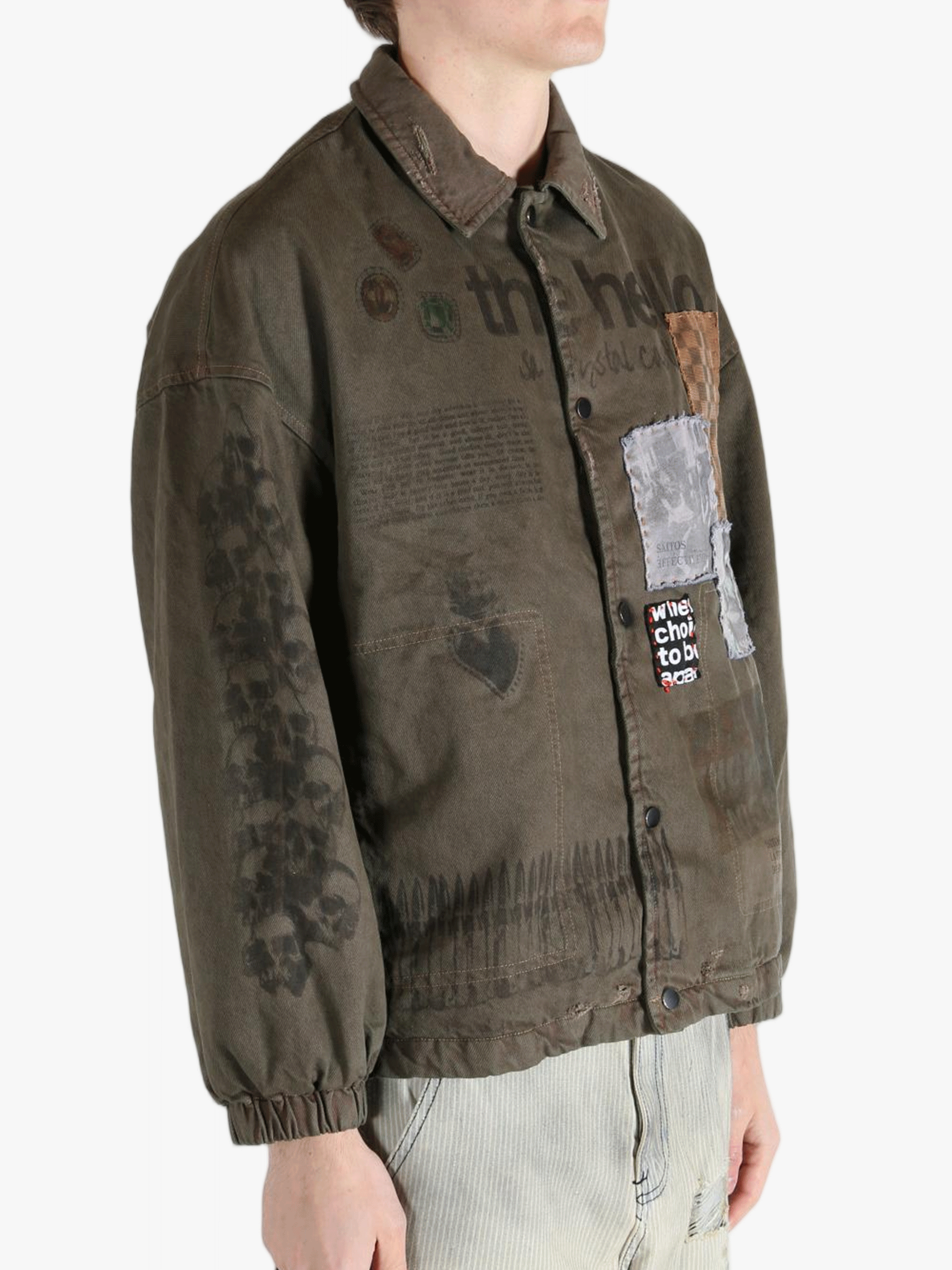 Green jacket worn by a person, showing the jacket's fit