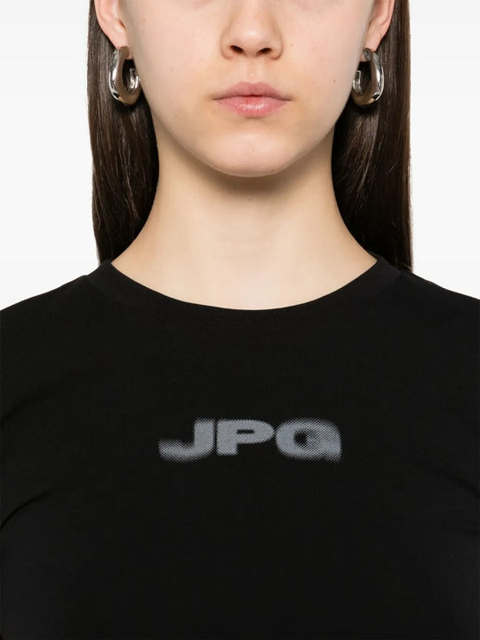 Close up of black shirt, showing texture of the cotton fabric