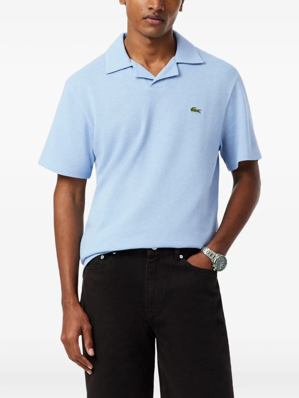 Blue shirt worn by a person, showing the shirt fit
