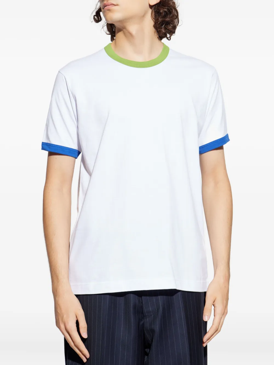 White t-shirt worn by a person, showing the shirt's fit