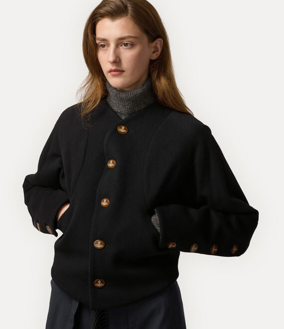 Black jacket worn by a person, showing the jacket fit