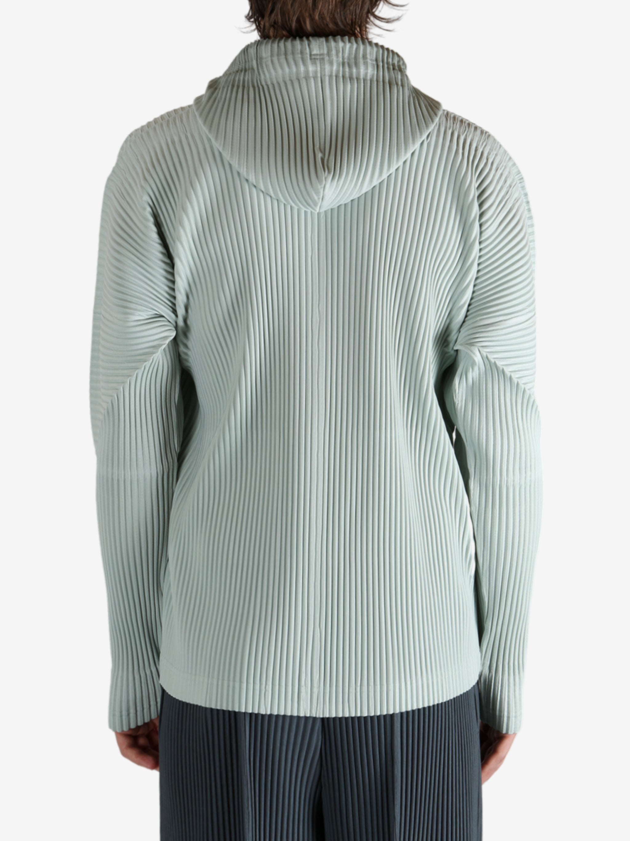 Blue jacket worn by a person, showing the jacket's fit