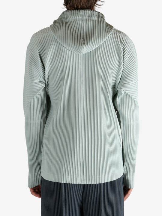 Blue jacket worn by a person, showing the jacket's fit