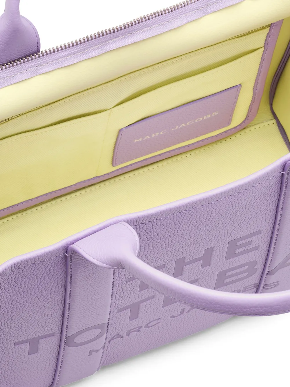 Close up of purple bag, showing texture of the leather fabric