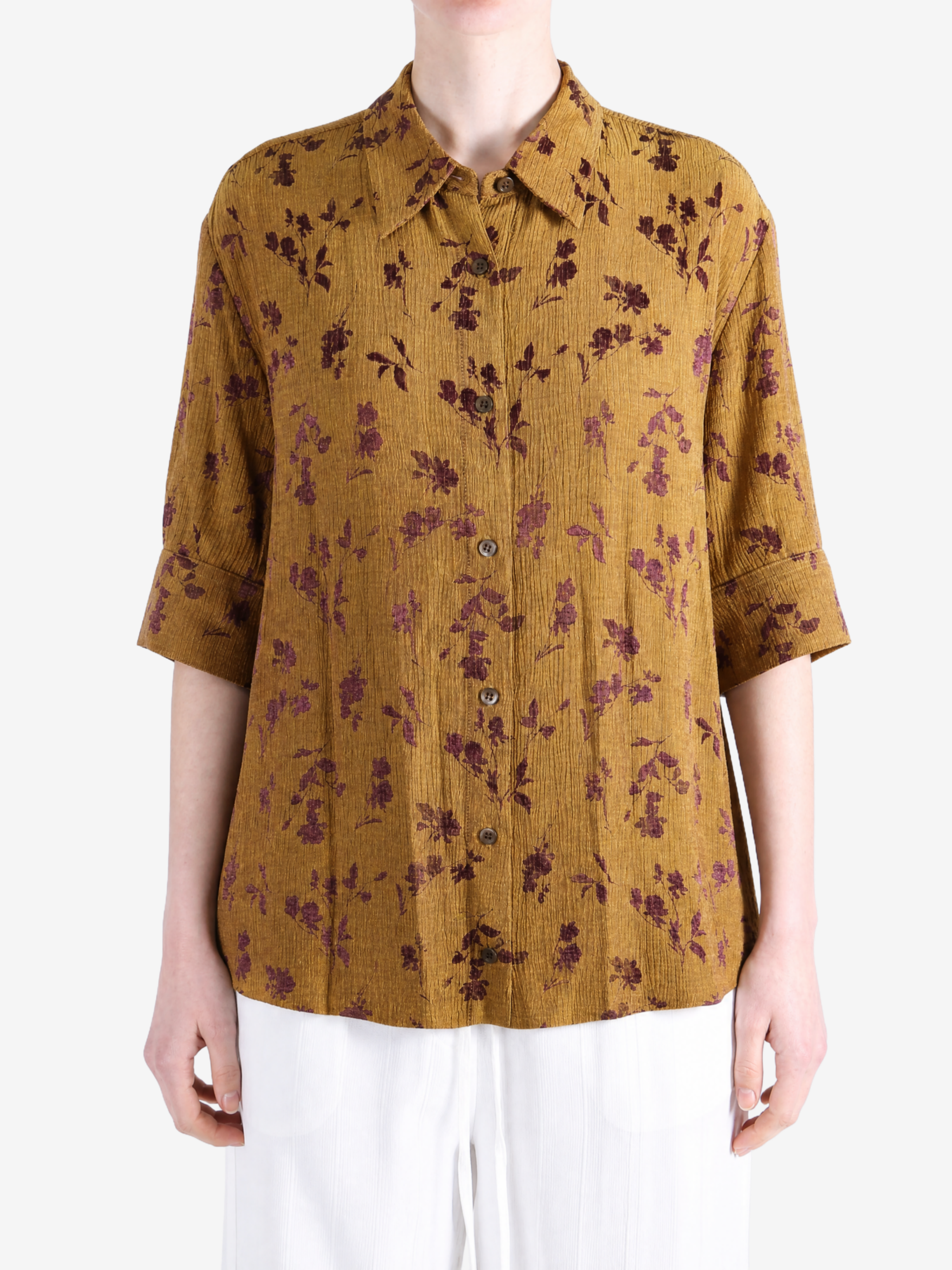 Yellow shirt worn by a person, showing the shirt fit