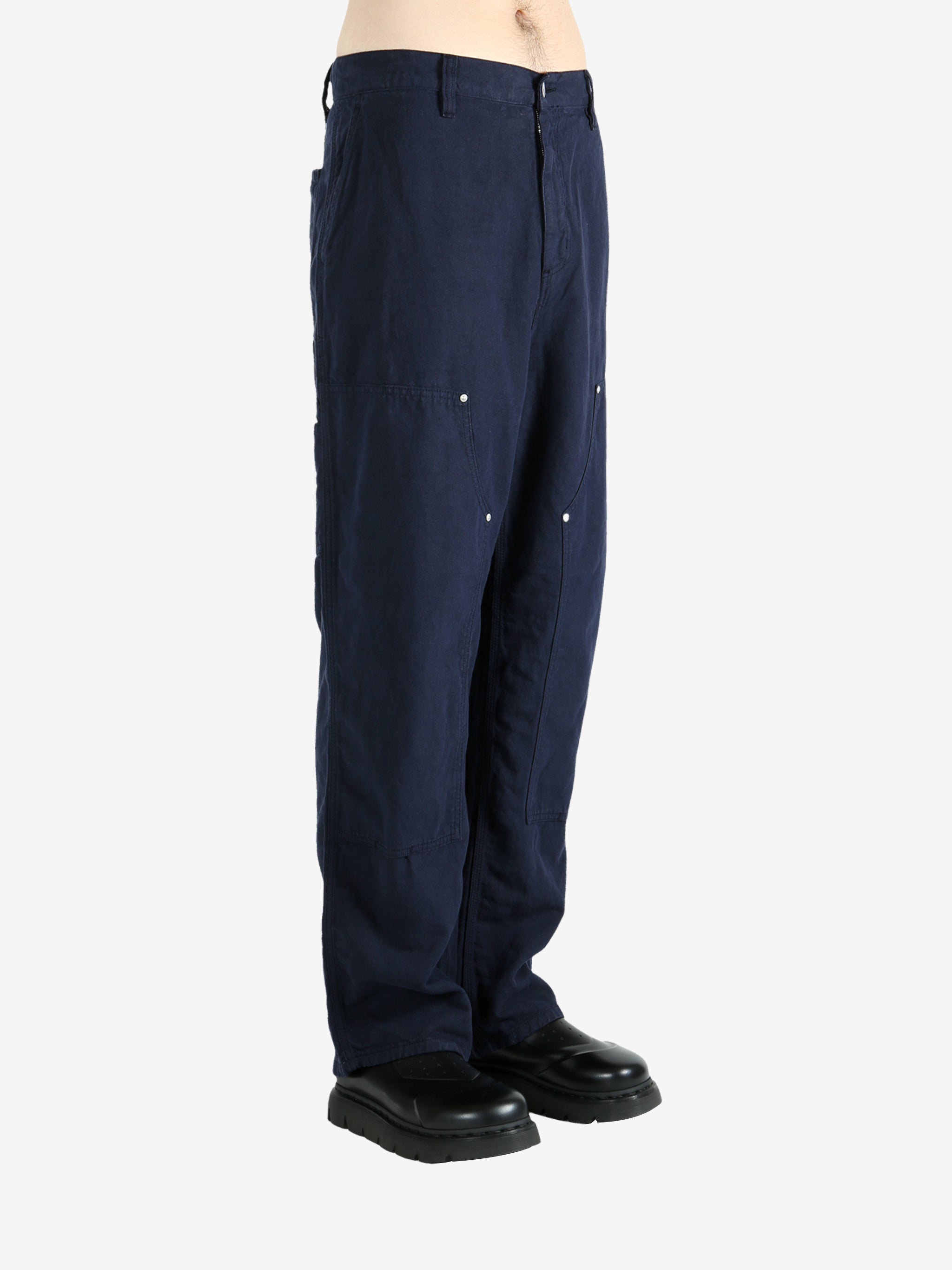 Blue pants worn by a person, showing the pants's fit