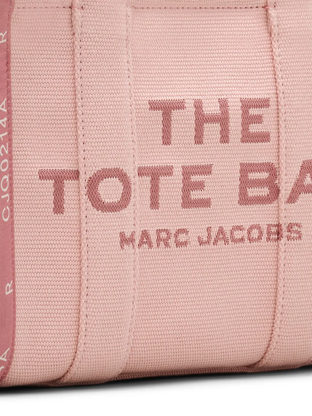 Close up of the pink bag, showing texture of the cotton fabric