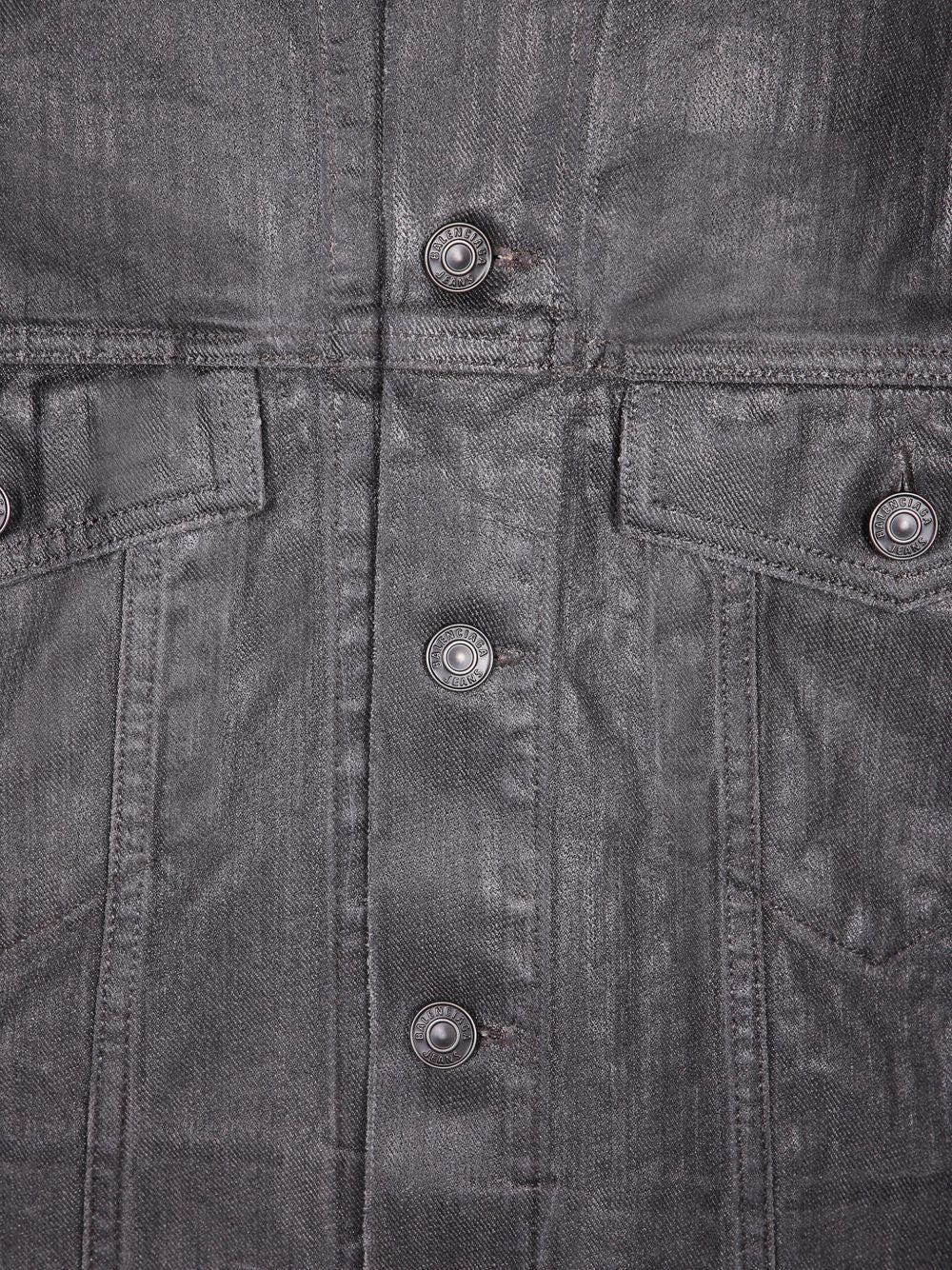 Close up of grey jackets, showing texture of the cotton fabric