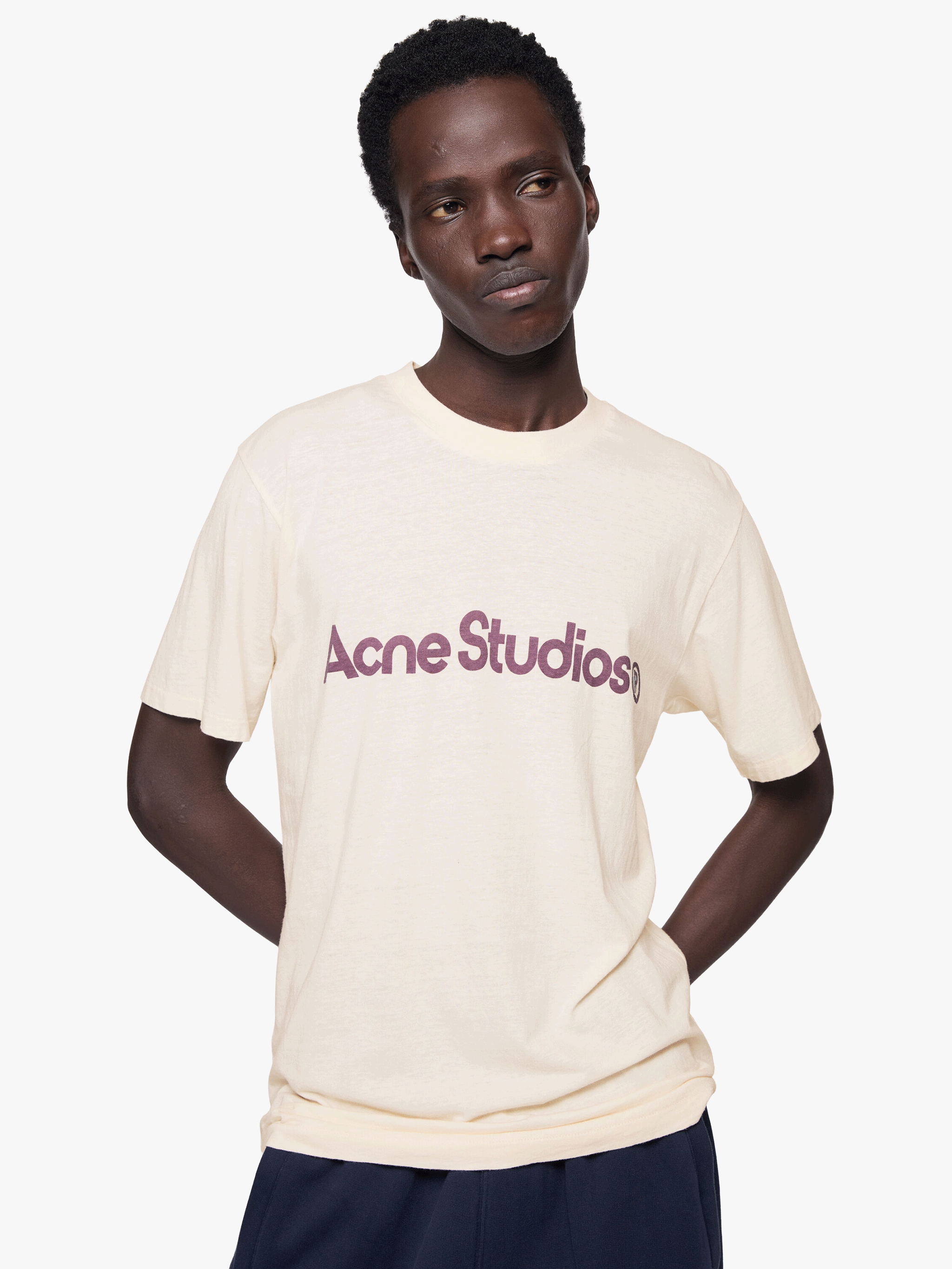Tan t-shirt worn by a person, showing the t-shirt fit