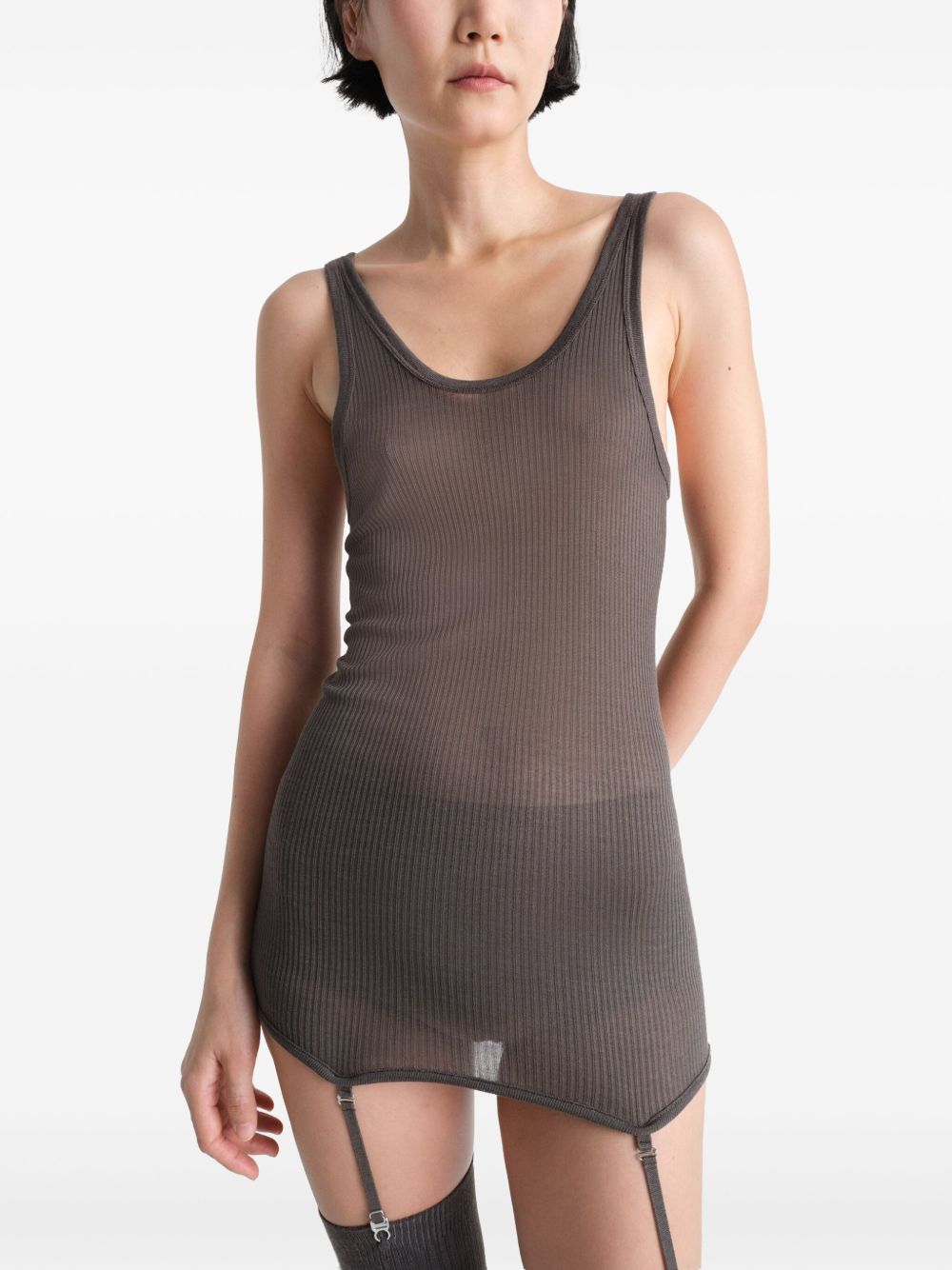 Brown top worn by a person, showing the top’s fit