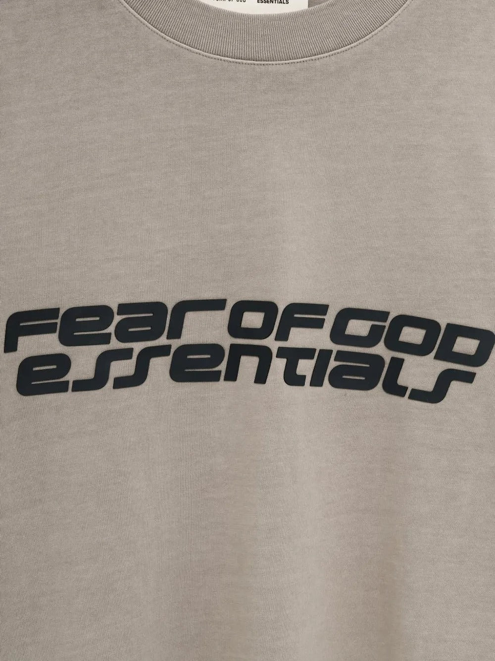 Close up of the grey t-shirt, showing texture of the cotton fabric