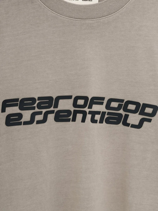 Close up of the grey t-shirt, showing texture of the cotton fabric