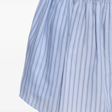 Close up of the blue shorts, showing texture of the lyocell fabric