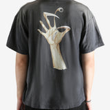 Black t-shirt worn by a person, showing the t-shirt's fit