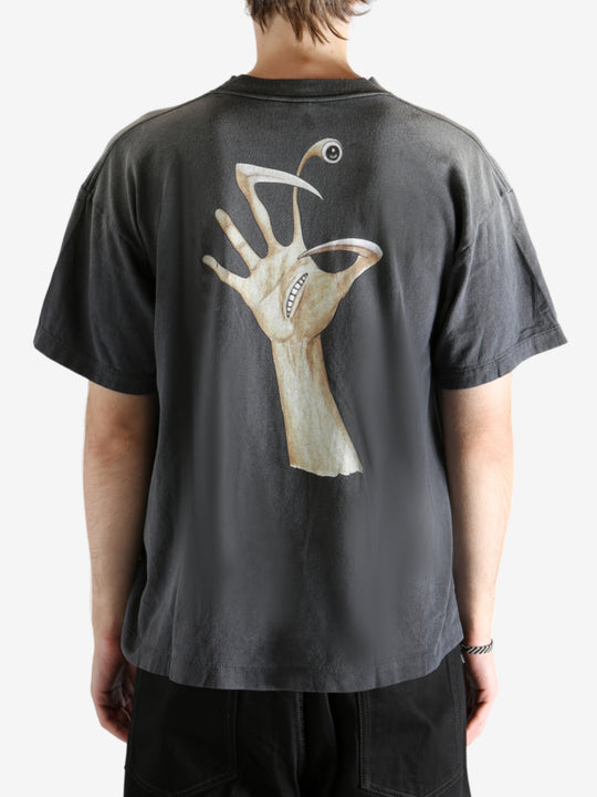 Black t-shirt worn by a person, showing the t-shirt's fit