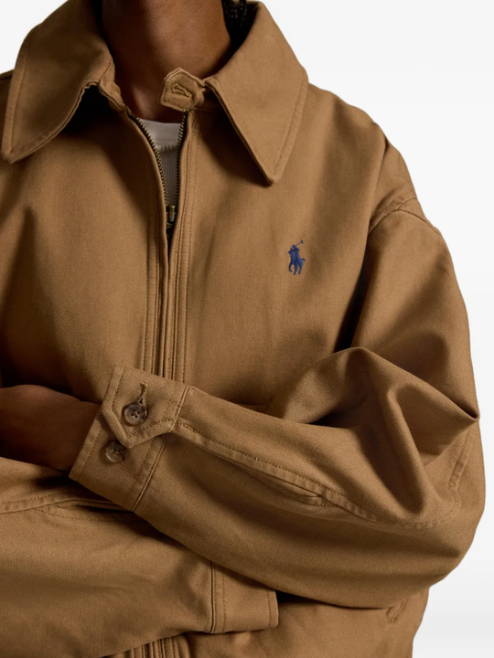 Close up of Brown jacket, showing texture of the cotton fabric