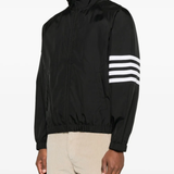 Black jacket worn by a person, showing the jacket fit