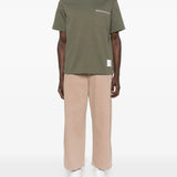 Green t-shirts, full body view