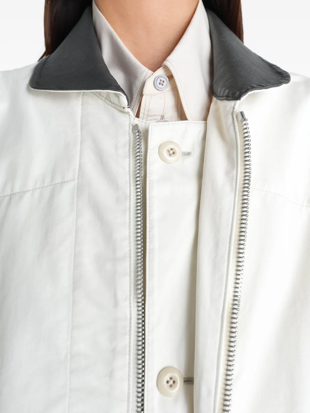 Tan jacket worn by a person, showing the jacket fit