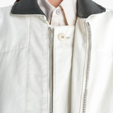 Tan jacket worn by a person, showing the jacket fit