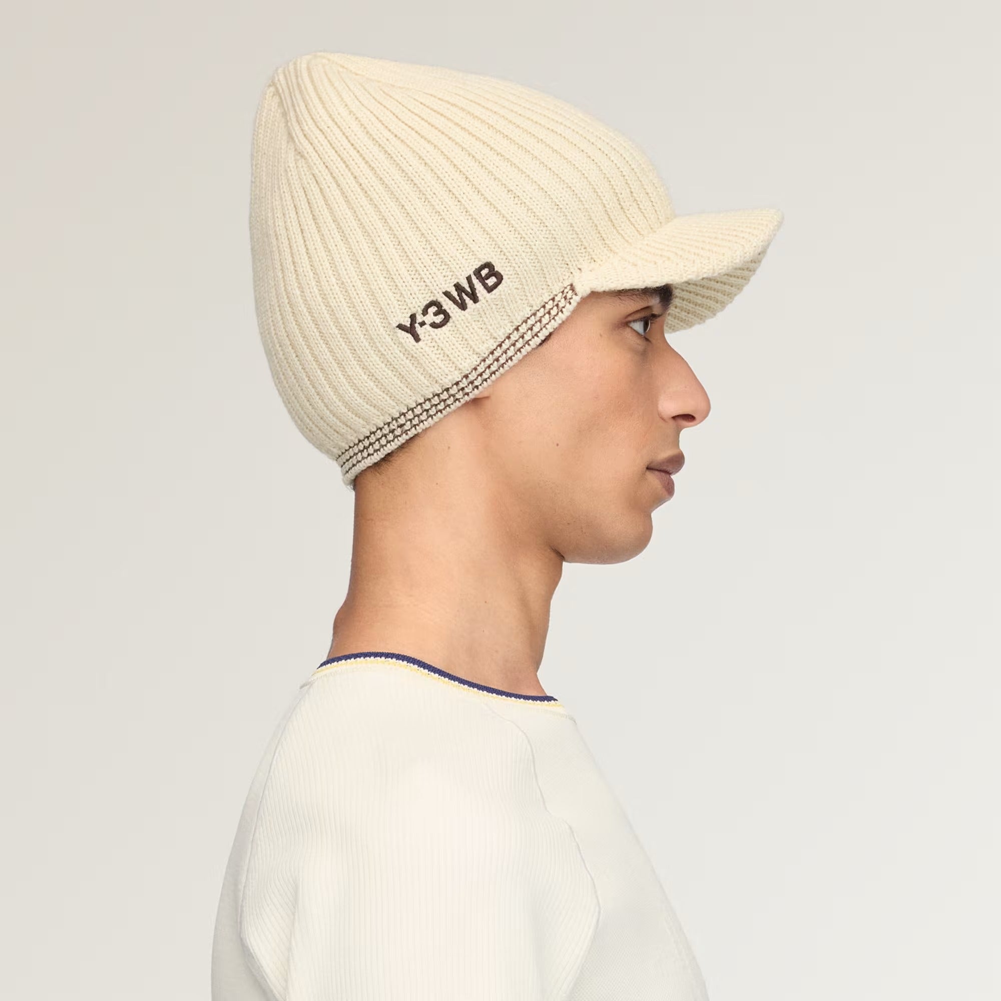Tan hat worn by a person, showing the hat fit