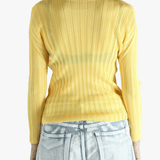 Yellow shirt worn by a person, showing the shirt's fit