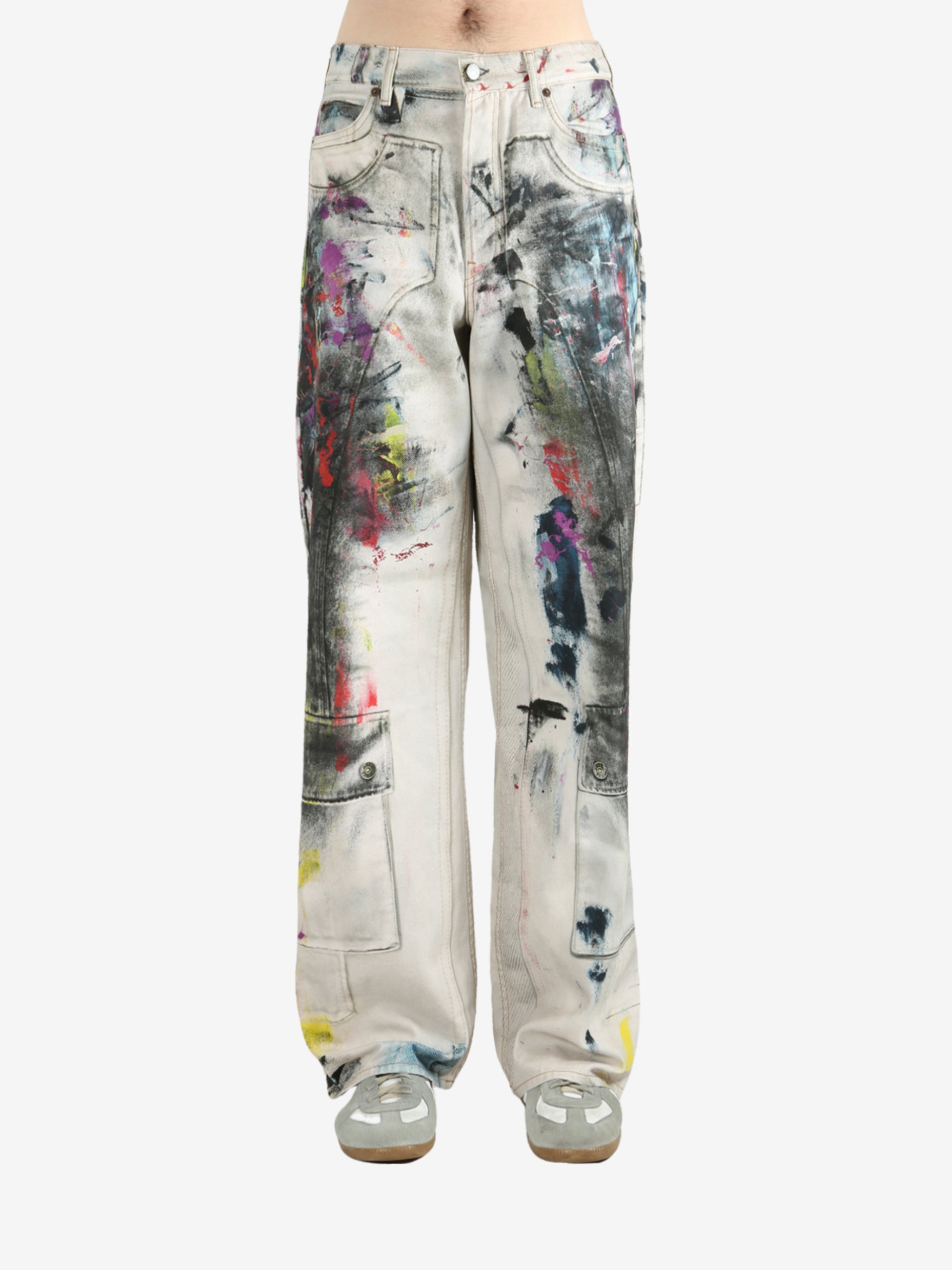 White pants worn by a person, showing the pants's fit