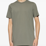 green t-shirts,worn by a person,showing the t-shirts fit