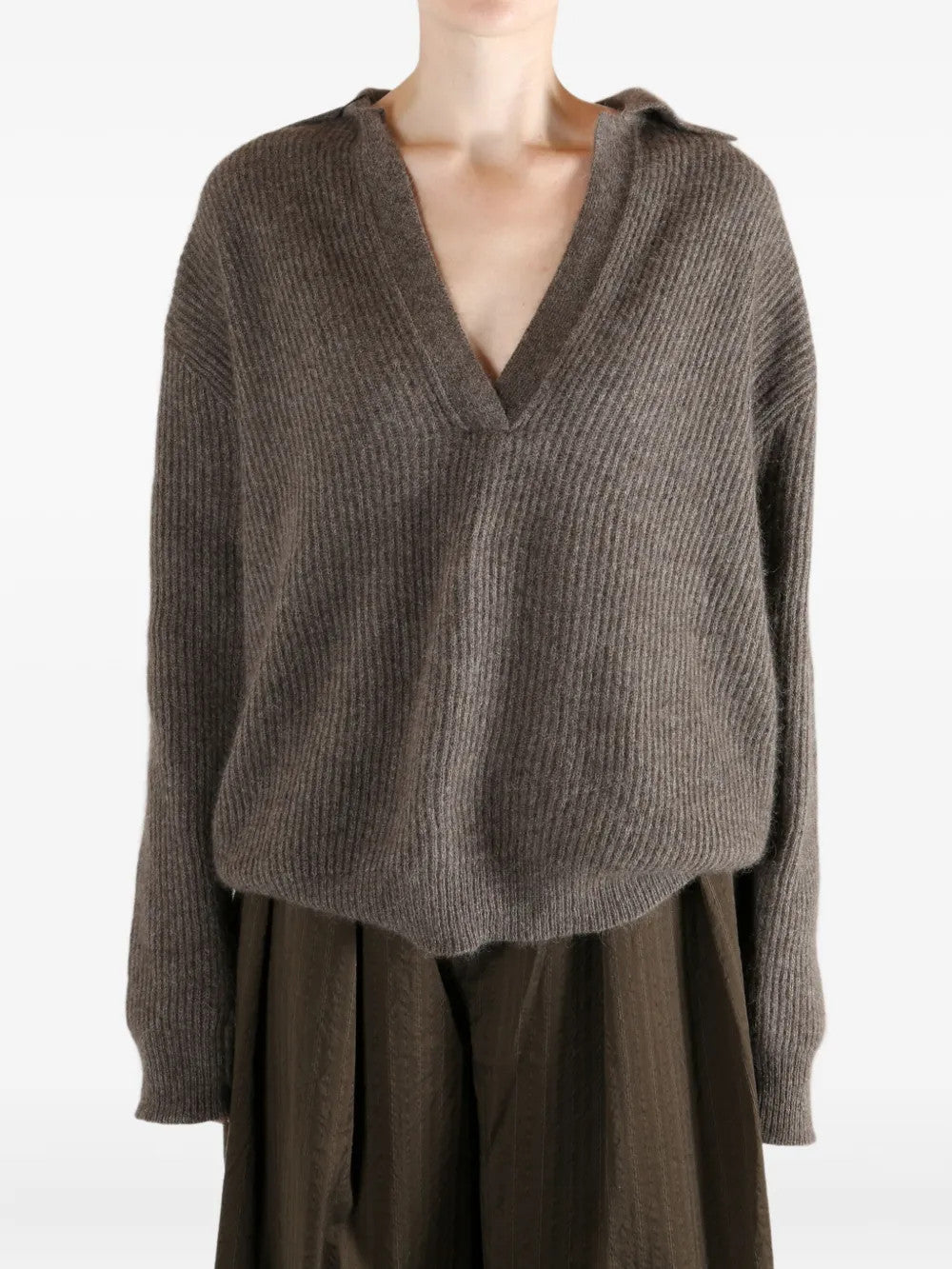 Brown top worn by a person, showing the top fit