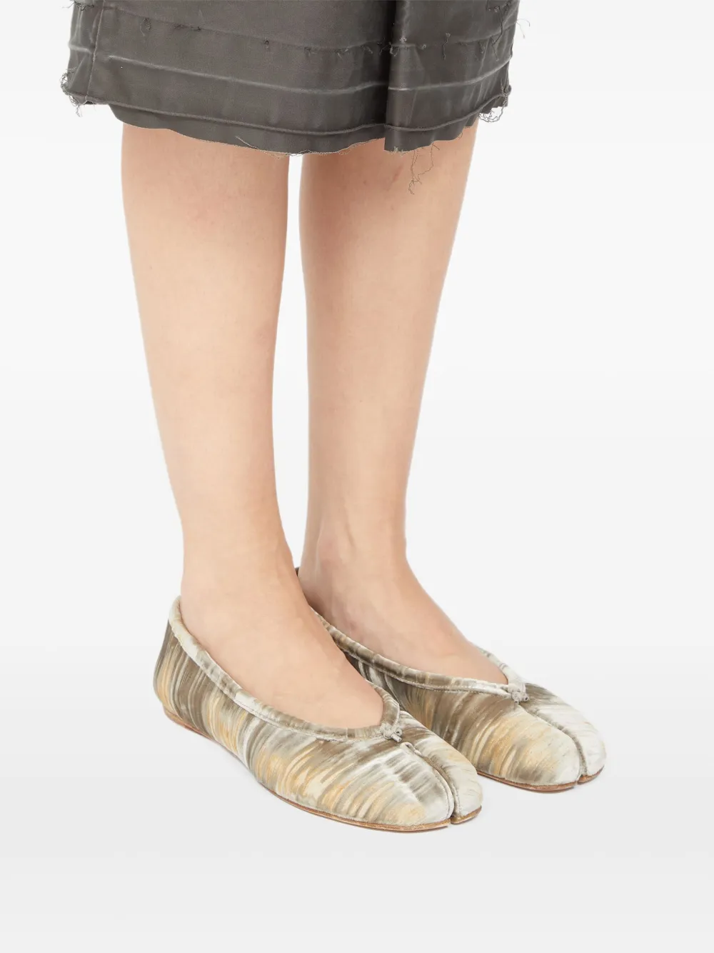 Tan shoes worn by a person, showing the shoes' fit